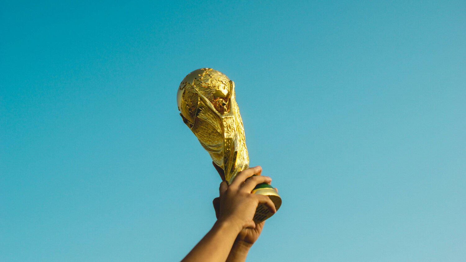 FIFA World Cup 2026 stadium with trophy and host nation flags